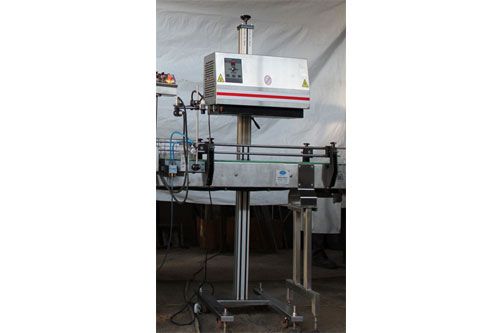 Online induction cap sealer